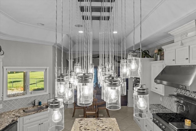 interior details with under cabinet range hood, a sink, white cabinets, range, and crown molding