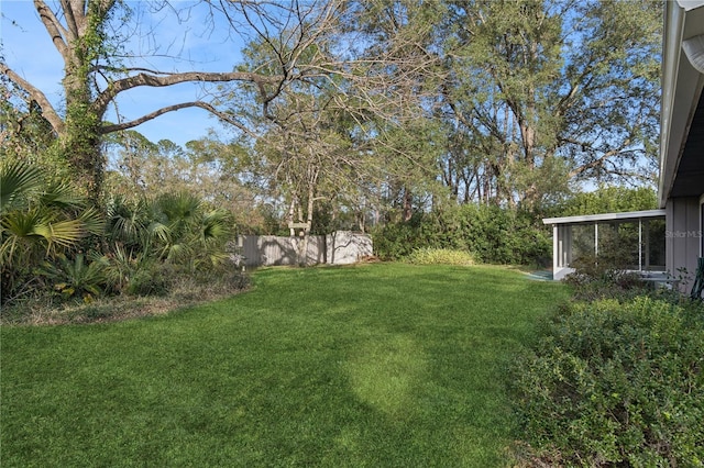 view of yard featuring a sunroom