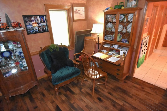 sitting room with hardwood / wood-style flooring