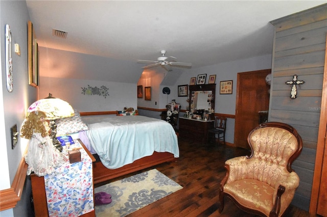 bedroom with lofted ceiling, dark hardwood / wood-style floors, and ceiling fan