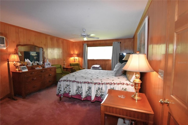 bedroom with dark colored carpet, ceiling fan, and wooden walls