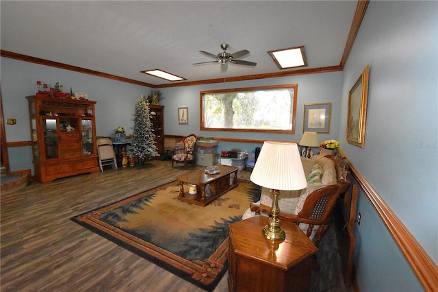 living room featuring crown molding, ceiling fan, and dark hardwood / wood-style floors