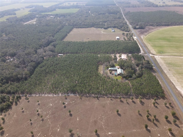 birds eye view of property with a rural view