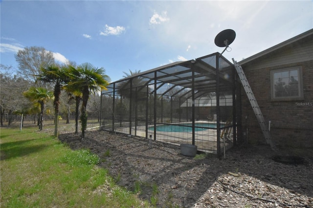 view of swimming pool with glass enclosure