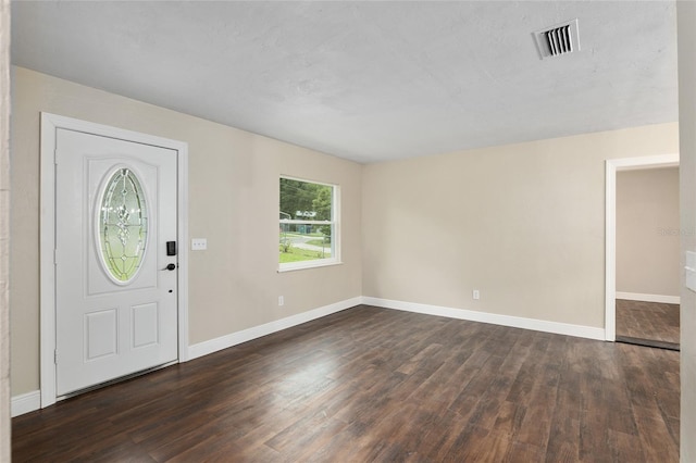 entrance foyer with dark hardwood / wood-style floors
