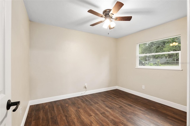empty room featuring ceiling fan and dark hardwood / wood-style flooring