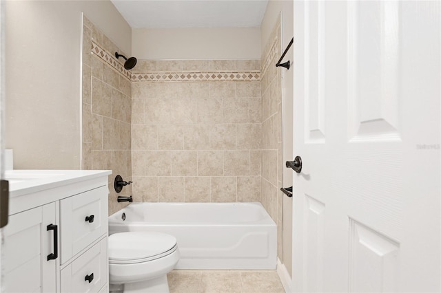 full bathroom with vanity, tile patterned flooring, tiled shower / bath combo, and toilet
