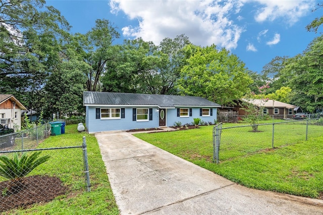ranch-style home featuring a front yard