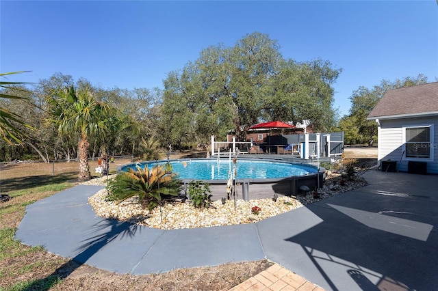 pool with a patio area