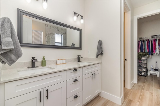 bathroom with vanity and walk in shower