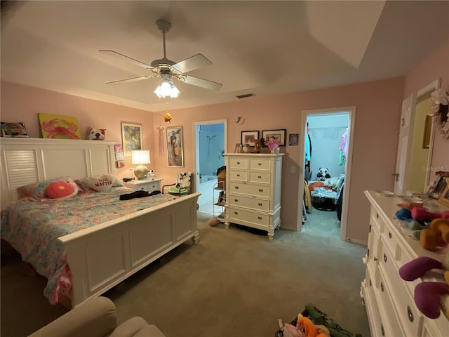 bedroom with carpet, a spacious closet, visible vents, and ceiling fan