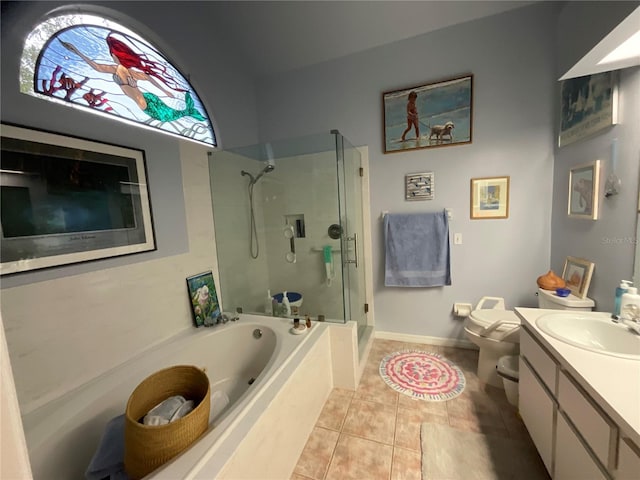 full bath featuring a garden tub, toilet, a shower stall, vanity, and tile patterned floors