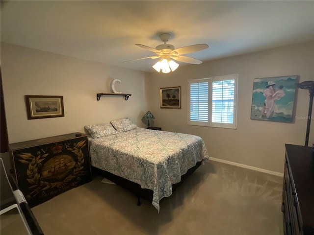 bedroom featuring carpet floors, a ceiling fan, and baseboards