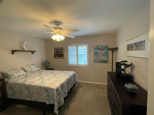 carpeted bedroom with baseboards and a ceiling fan