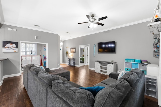 living area with visible vents, a ceiling fan, wood-type flooring, crown molding, and baseboards