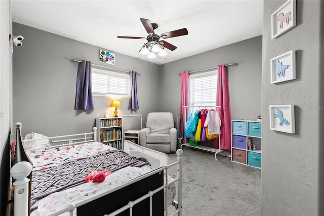 carpeted bedroom featuring a ceiling fan