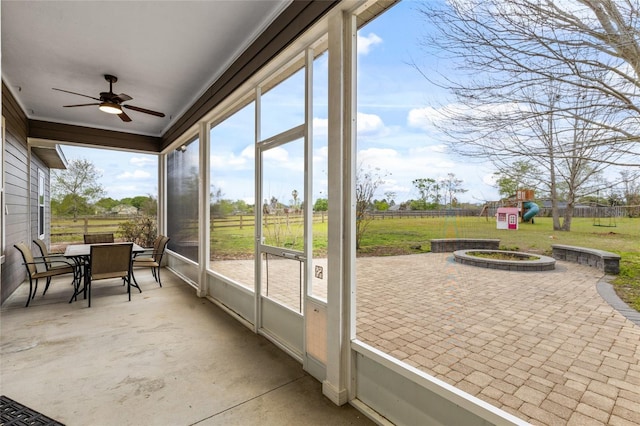 sunroom / solarium with ceiling fan