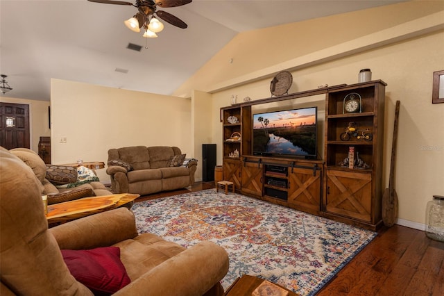 living area featuring wood finished floors, a ceiling fan, baseboards, visible vents, and vaulted ceiling