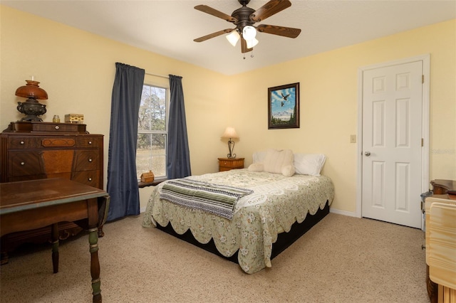 bedroom featuring baseboards and ceiling fan