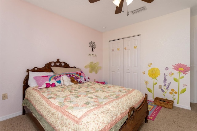 carpeted bedroom featuring a ceiling fan, baseboards, visible vents, and a closet