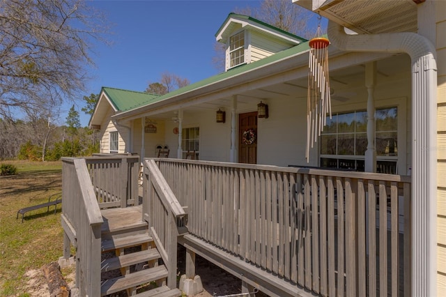 view of exterior entry featuring metal roof