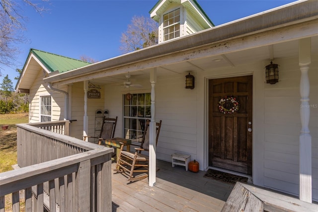 deck with a porch and a ceiling fan