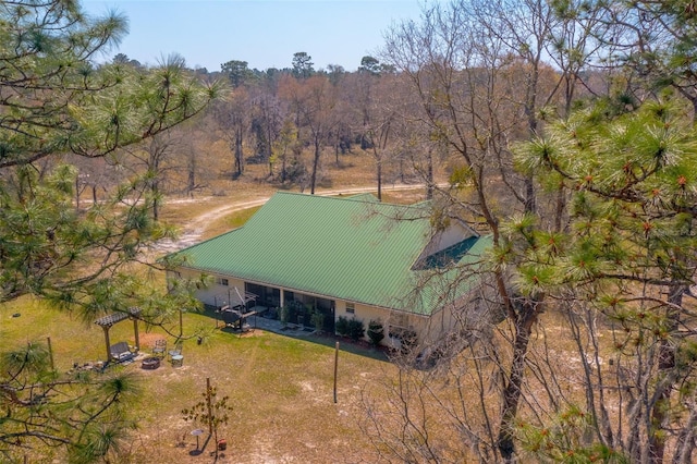 drone / aerial view with a view of trees