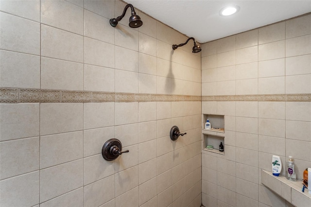 bathroom with tiled shower