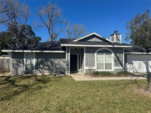 single story home featuring a garage, a front yard, fence, and a chimney