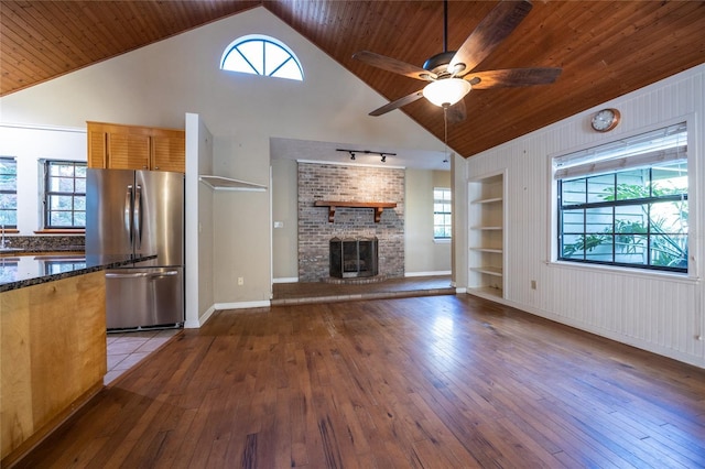 unfurnished living room with wood ceiling, hardwood / wood-style flooring, and a healthy amount of sunlight