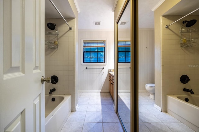 full bath with toilet, tile patterned flooring, vanity, and shower / bathing tub combination