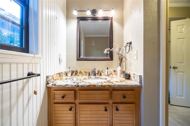 bathroom with tile patterned floors and vanity