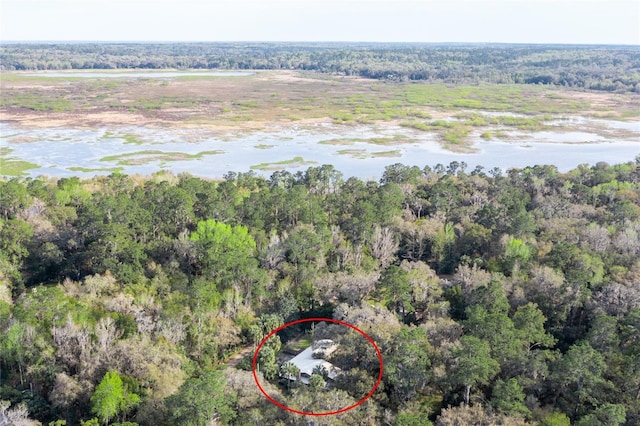 drone / aerial view featuring a forest view