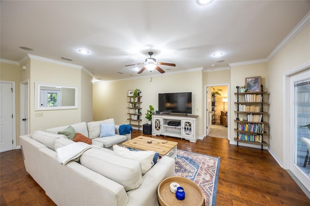 living room with crown molding, visible vents, dark wood-type flooring, ceiling fan, and baseboards