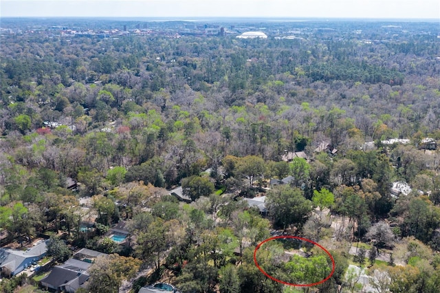 aerial view with a wooded view