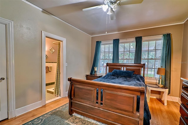 bedroom featuring a ceiling fan, ornamental molding, wood finished floors, and ensuite bathroom