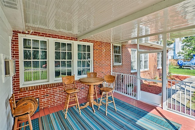 sunroom featuring wood ceiling