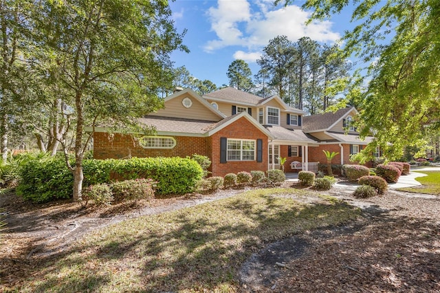 view of front of house with brick siding