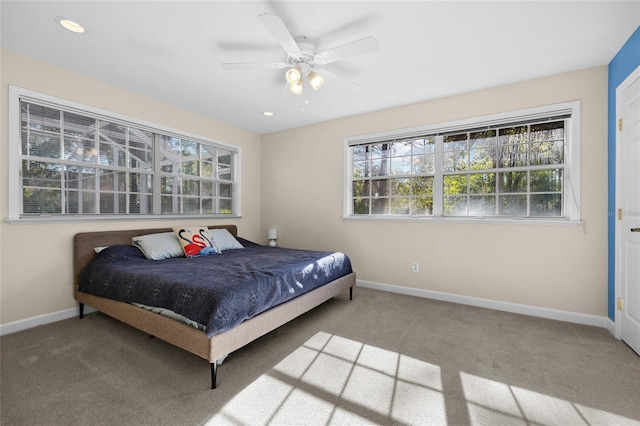 carpeted bedroom with recessed lighting, multiple windows, and baseboards