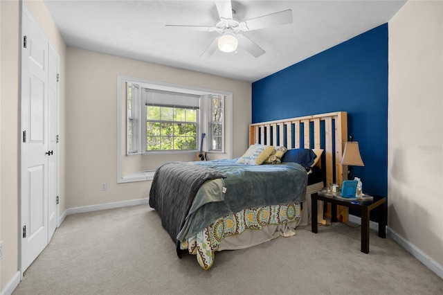 bedroom featuring baseboards, carpet floors, and ceiling fan