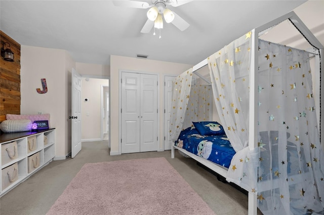 bedroom featuring a ceiling fan, visible vents, a closet, and baseboards