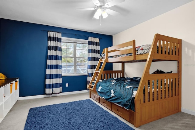 carpeted bedroom with baseboards and ceiling fan