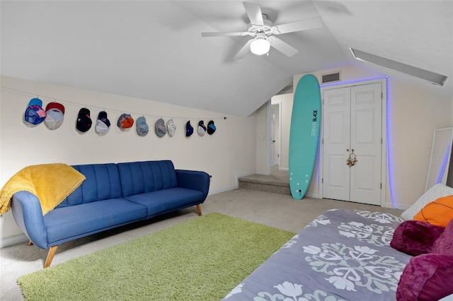 living area with visible vents, carpet flooring, baseboards, and lofted ceiling