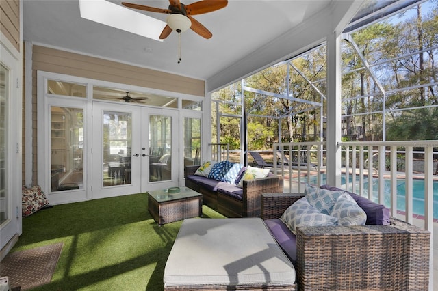 sunroom with french doors and a ceiling fan