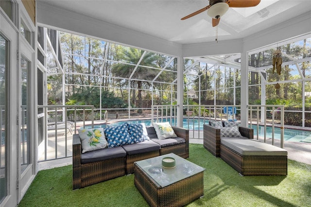 sunroom / solarium with a ceiling fan