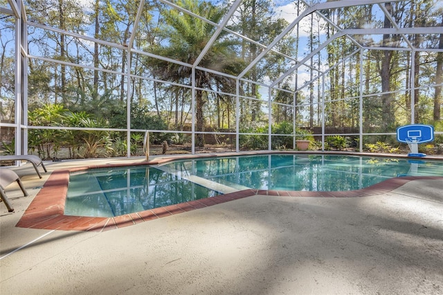 pool featuring a lanai and a patio area