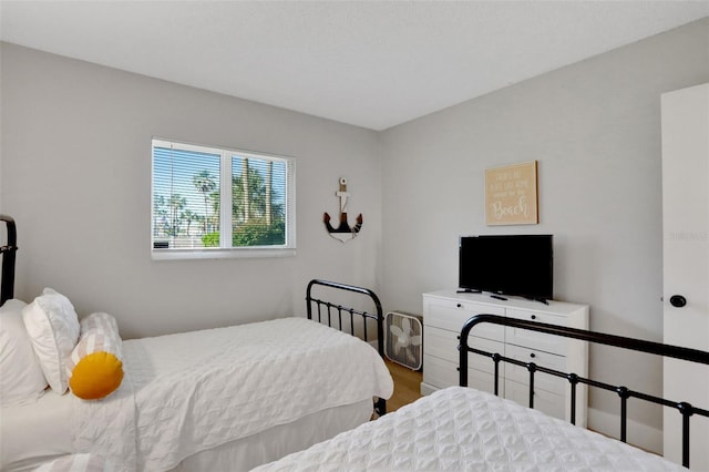 bedroom with wood finished floors