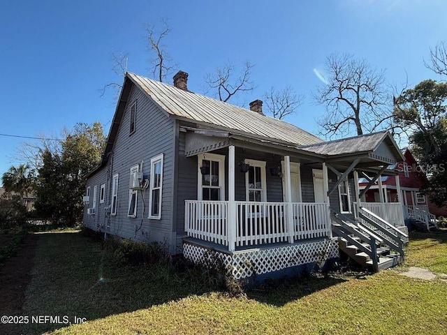 view of front of house featuring a front lawn and a porch