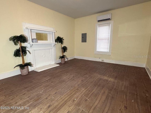 spare room with a wall mounted AC, dark hardwood / wood-style flooring, and electric panel