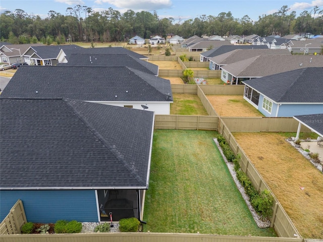 birds eye view of property with a residential view